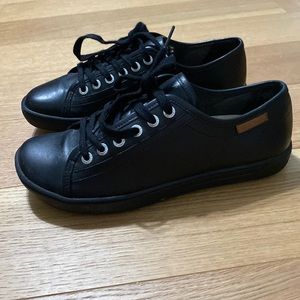 A pair of women’s black Birkenstock women size 38 lace up shoes. Like new!